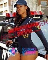 a black stripper dressed in a police costume in Manhattan 