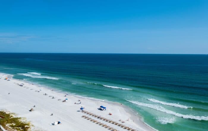 featured-image-1749387677 | Hot Party Stripper Ocean with chairs and umbrellas in Panama City beach Florida