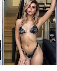 A woman in a bikini and a black and white camo bikini.