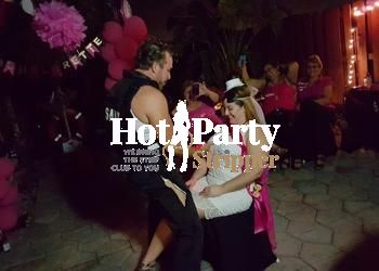 Sean Michaels performing as male stripper in police costume at classy West Miami bachelorette party